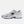 White running shoe with black sole and New Balance logo on a white background