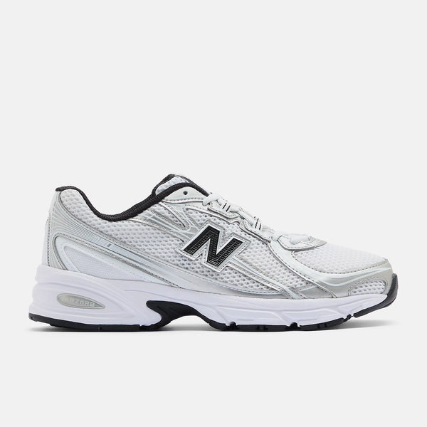 White athletic shoe with black accents on a white background