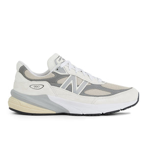 A pair of New Balance running shoes with a primarily gray color and white accents.
