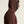 Person wearing a brown hooded garment against a beige background