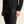 Person wearing black athletic leggings with Craft logo on a beige background