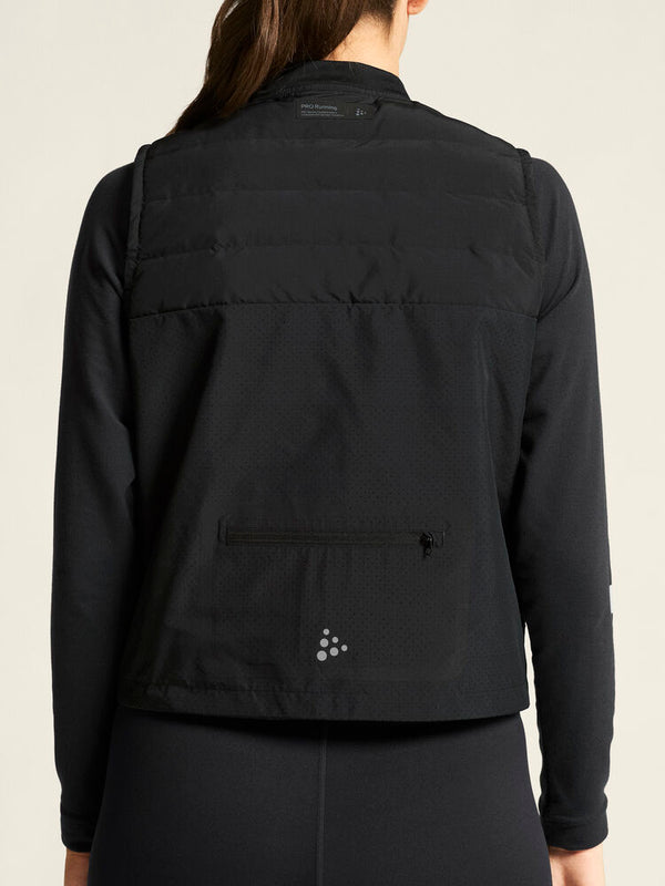 Black jacket worn by a person on a plain background