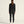 Person wearing a black outfit on a light gray background