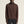 Man wearing a brown ribbed sweater against a beige background