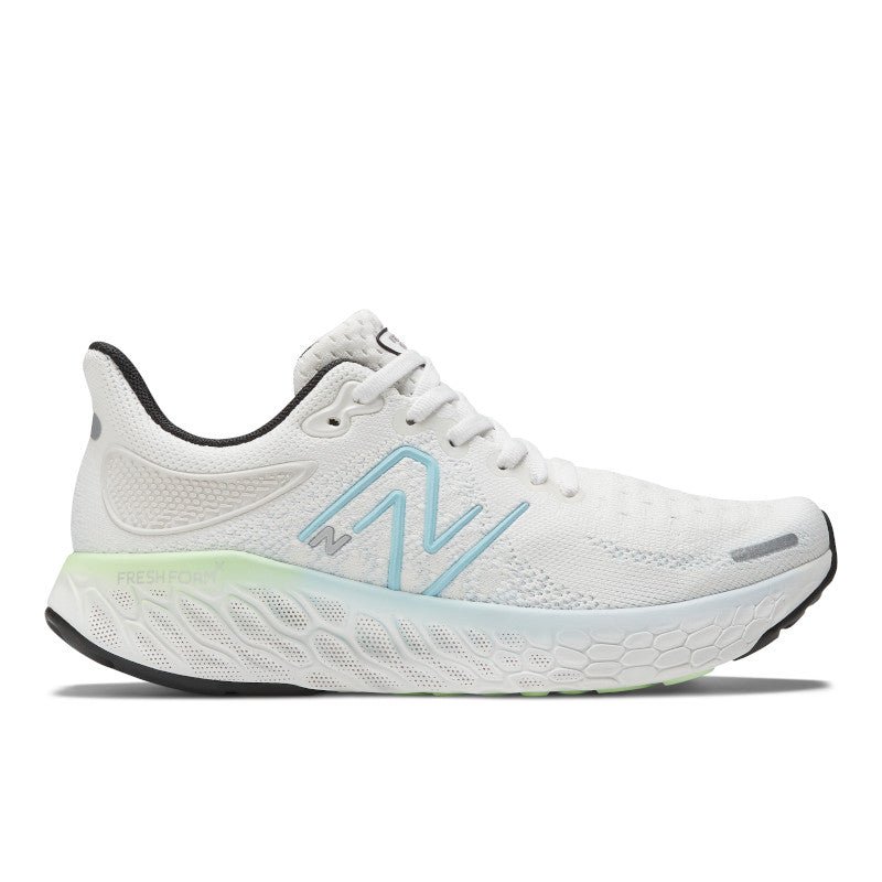 Lateral view of the Women's 1080 V12 from New Balance in the color White/Bleach Blue/Green Aura