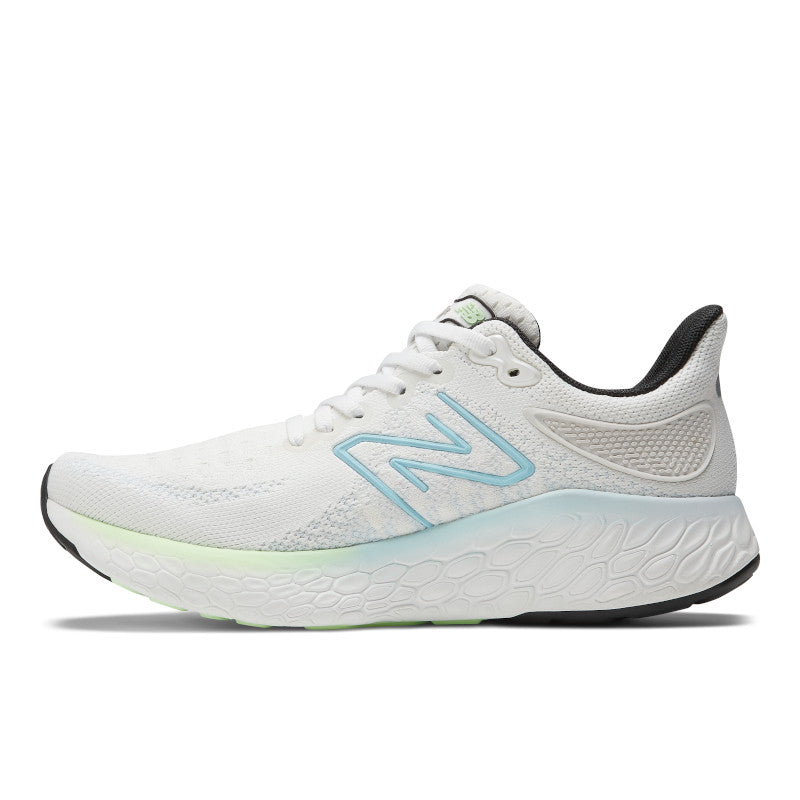 Medial view of the Women's 1080 V12 from New Balance in the color White/Bleach Blue/Green Aura