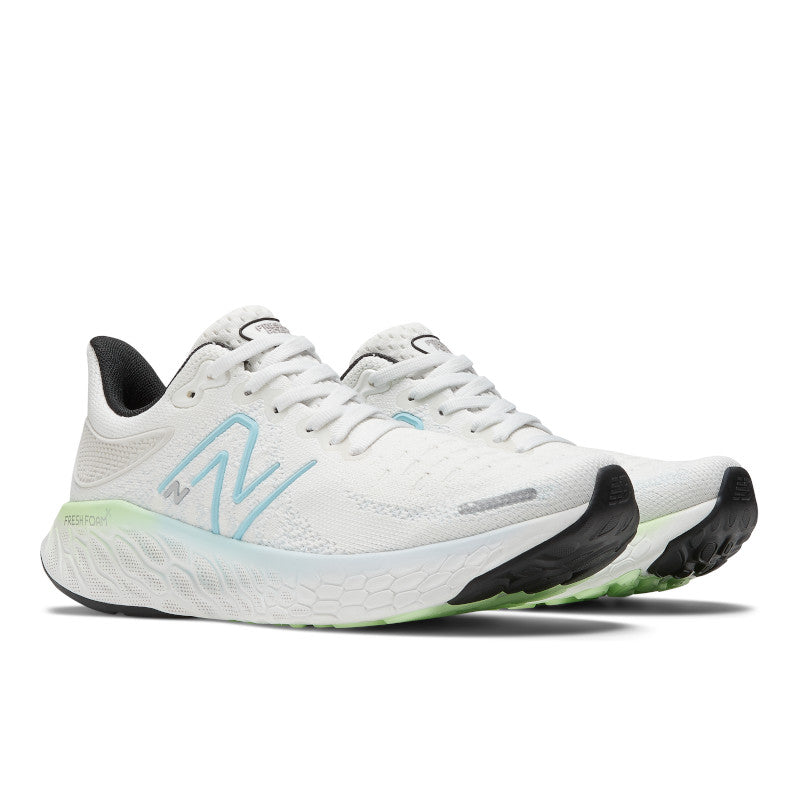 Front angled view of the Women's 1080 V12 from New Balance in the color White/Bleach Blue/Green Aura
