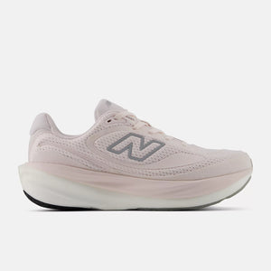Pink running shoe with New Balance logo on a white background