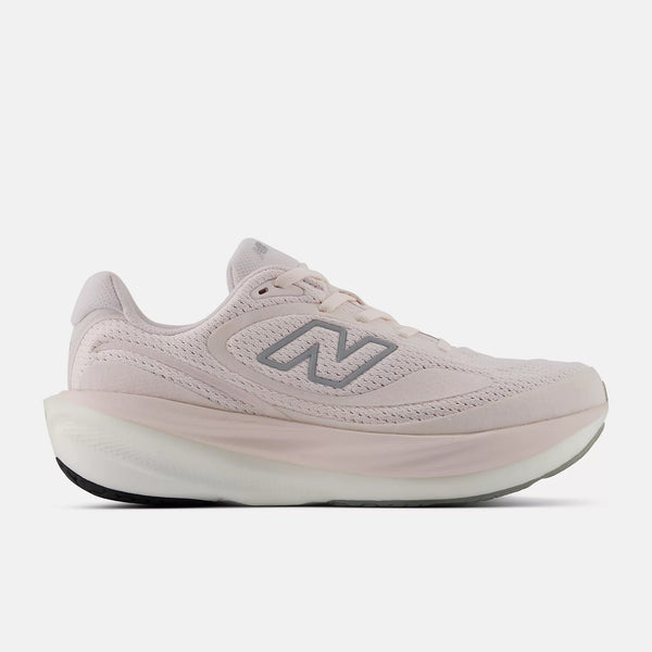 Pink running shoe with New Balance logo on a white background