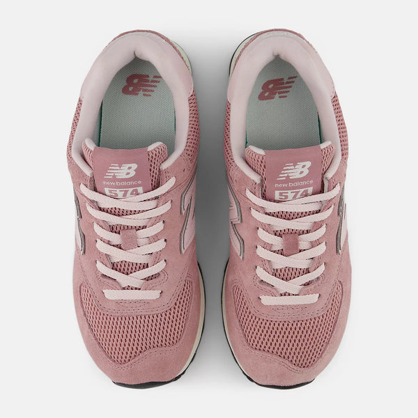 Pair of pink New Balance sneakers on a white background