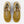 A pair of New Balance 574 sneakers in a mustard yellow and beige colorway, shown from a top-down view on a light gray background.