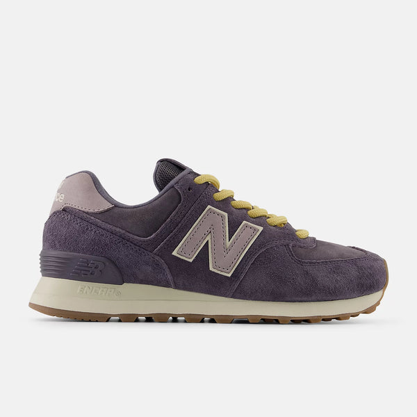Purple sneaker with yellow accents on a white background