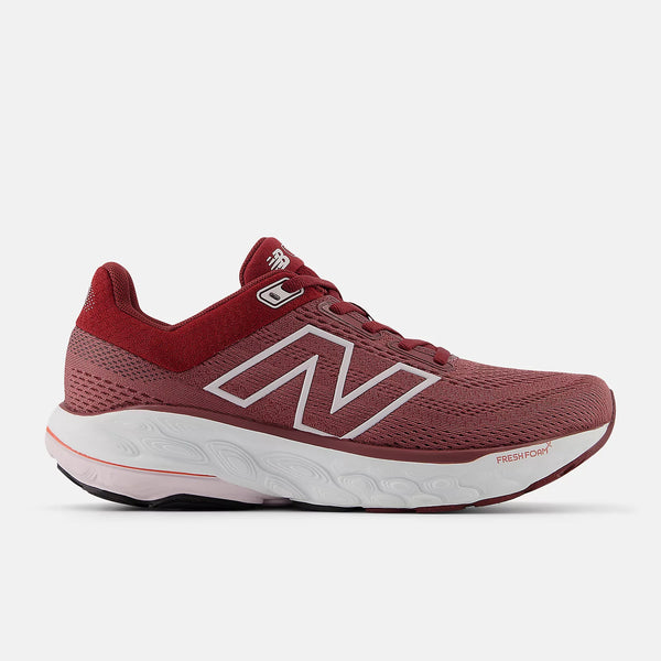 Light burundy women's running shoe with white sole on a light gray background