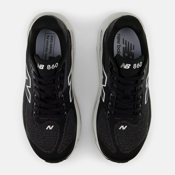 Black New Balance 860 running shoes on a white background