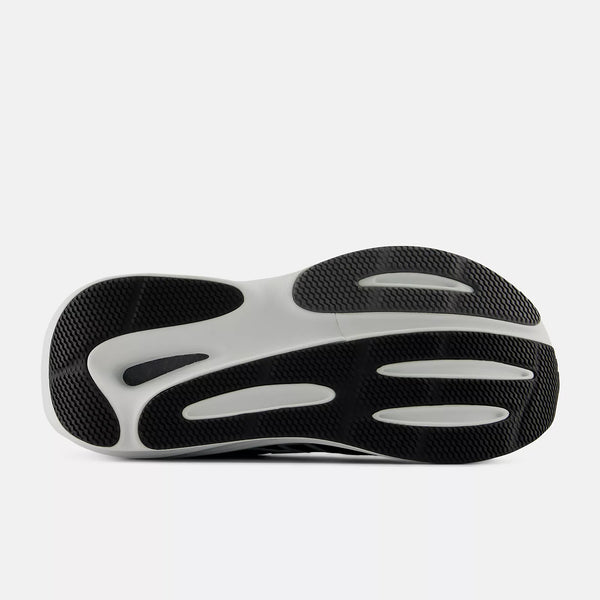 The black and white outsole of a black and white running shoe.