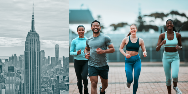 Empire State Building to the left of a group of Runners.  There are 4 runners.  One male out front and three women behind him.  They are in focus and the background is blurred out.