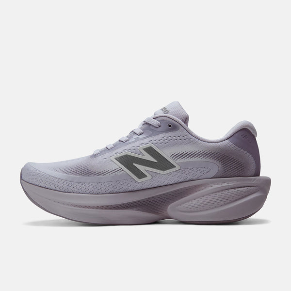 A New Balance running shoe in light lavender and gray, shown from a side profile view against a light gray background.