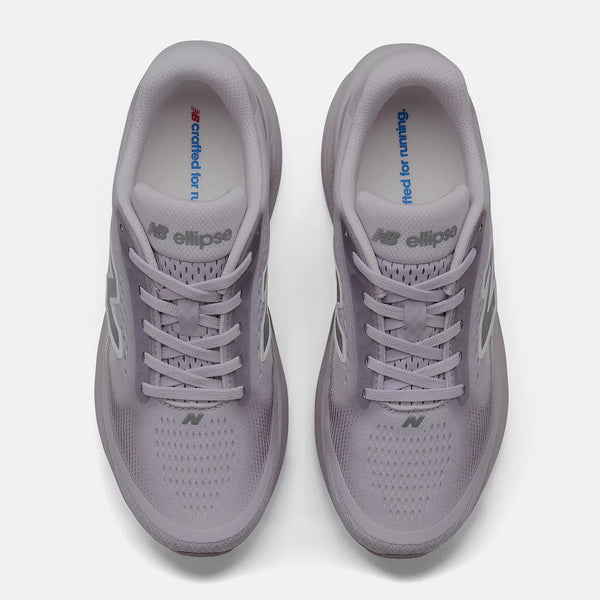 A pair of New Balance running shoes in a light lavender-gray color, shown from a top-down view on a clean white background.