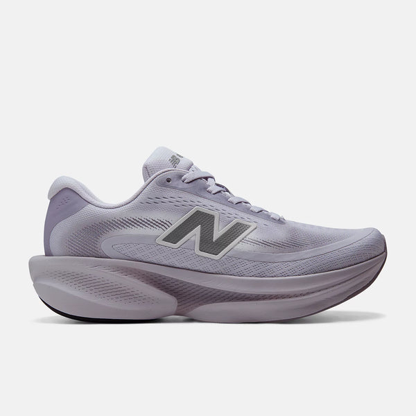 A New Balance running shoe in a light lavender-gray colorway, featuring a textured mesh upper, a prominent 'N' logo on the side, and a thick cushioned sole, shown against a plain light gray background.