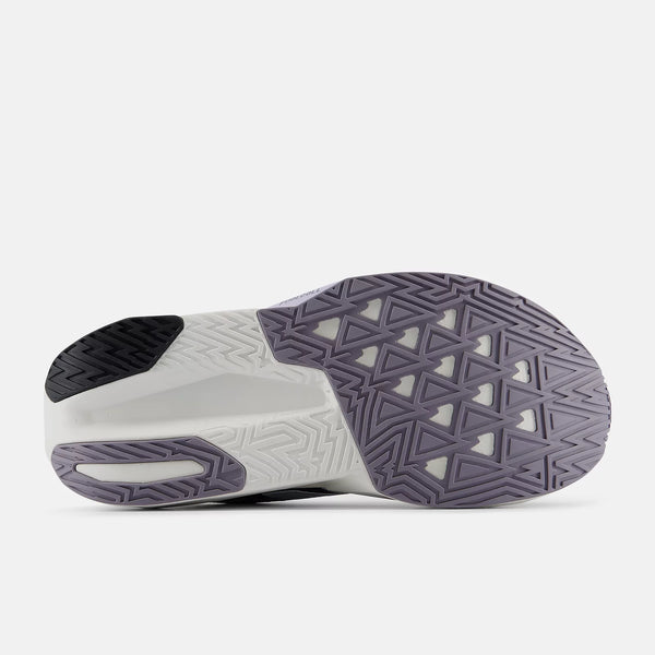 The outsole of a sneaker shown from a side profile view, featuring a white midsole with a dark gray and black treaded rubber outsole.