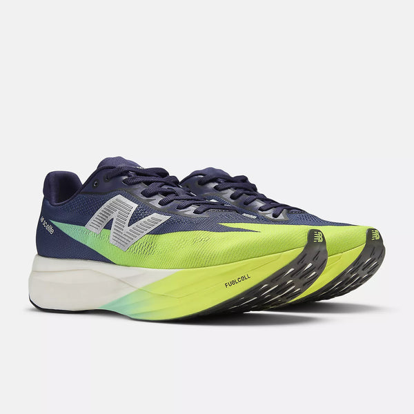 Navy and green running shoe with New Balance logo on a light gray background