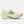 A New Balance running shoe in a pale cream-yellow colorway, featuring a textured mesh upper, matching laces, a thick sculpted foam midsole, and a metallic silver 'N' logo on the side.
