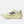 A New Balance running shoe in a pale cream-yellow colorway, featuring a textured mesh upper, matching laces, a thick sculpted foam midsole, and a metallic silver 'N' logo on the side.