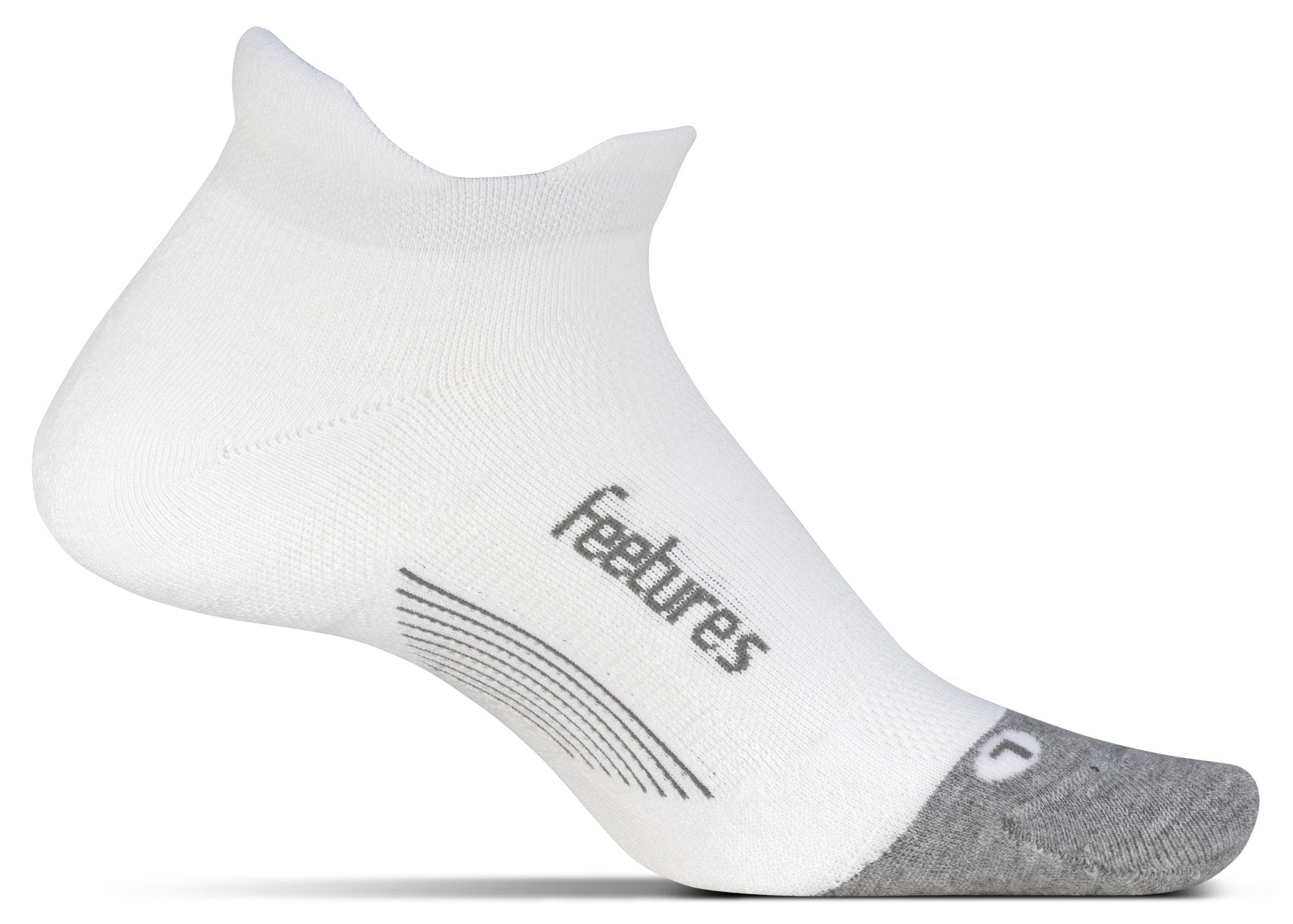 A medial view of the Feetures Elite Max Cushion running sock (left foot) in the color white.