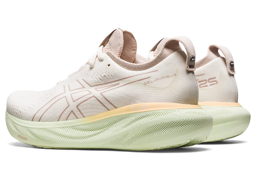 Back angled view of the Women's ASICS Nimbus 25 in the color Cream / Fawn