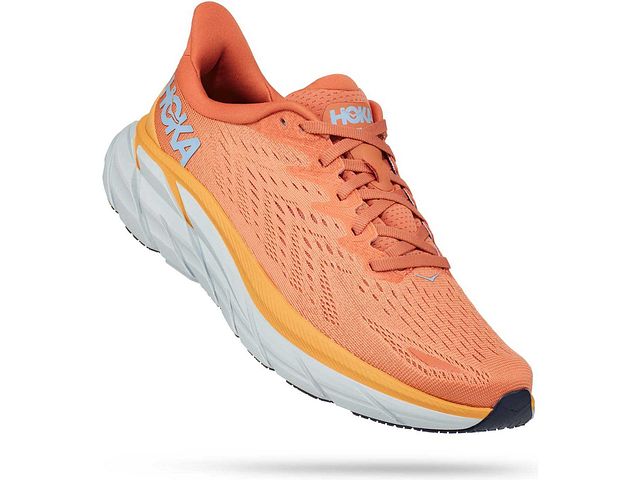 Lateral angled view of the Women's HOKA Clifton 8 in the color Sun Baked / Shell Coral