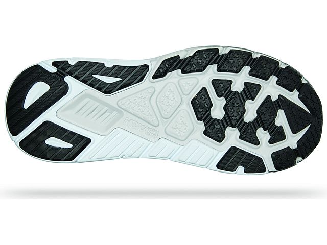 Bottom (outer sole) view of the Men's Arahi 6 by HOKA in the color Black/White