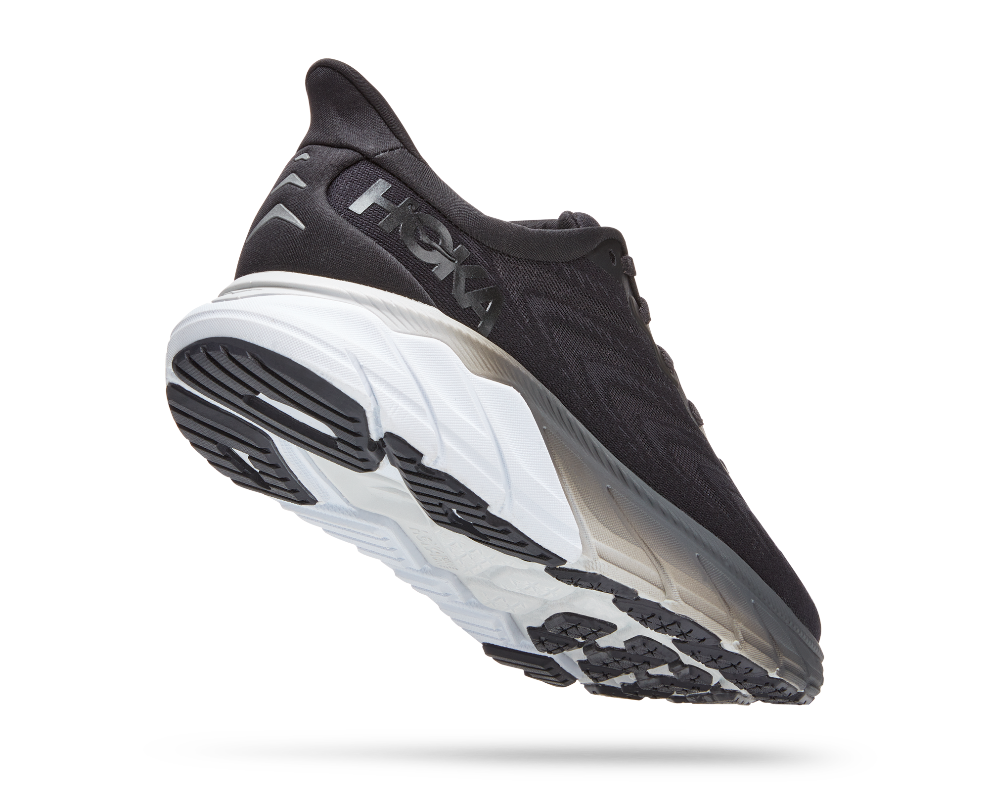 Back angled view of the Women's Arahi 6 by HOKA in the color Black/White