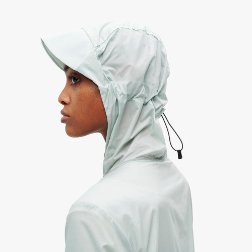  Zoomed in view of the hood on a model wearing the Women's Weather Jacket by ON in the color Surf/Sea