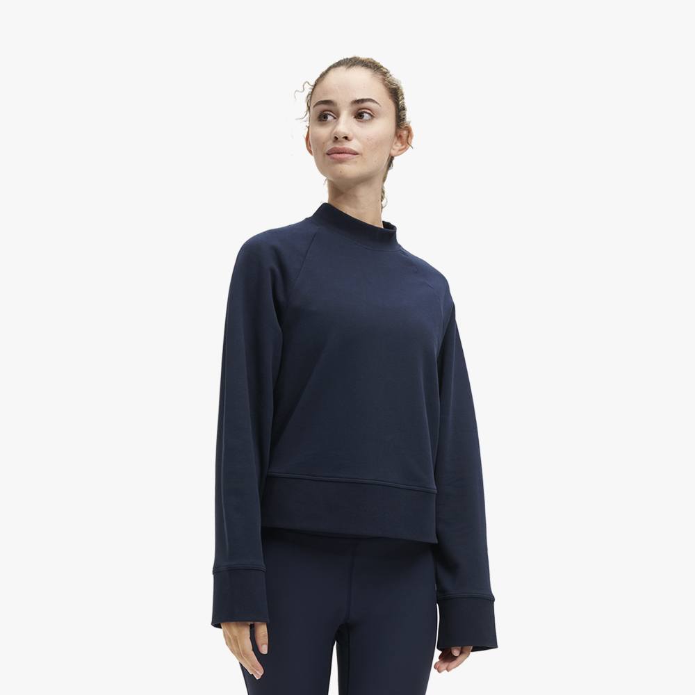 Front view of a model wearing the Women's Crew Neck by ON in the color Navy