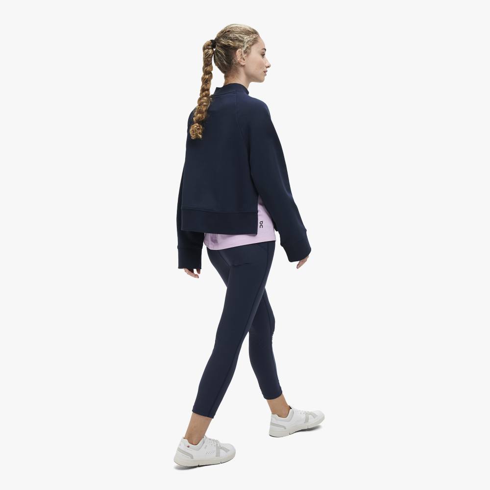 Side view of a model wearing the Women's Crew Neck by ON in the color Navy