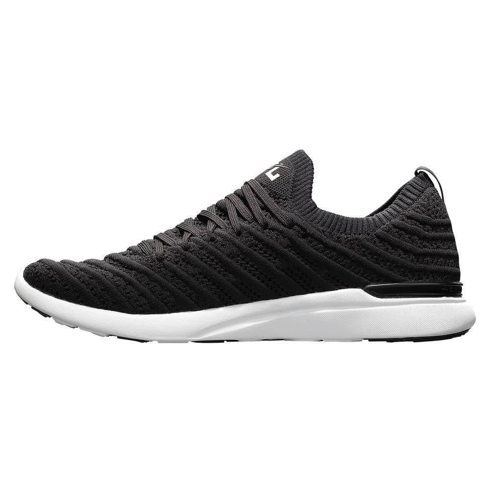 Men's APL Tech Loom Wave in Black and White with a  medial side view of the APL shoe