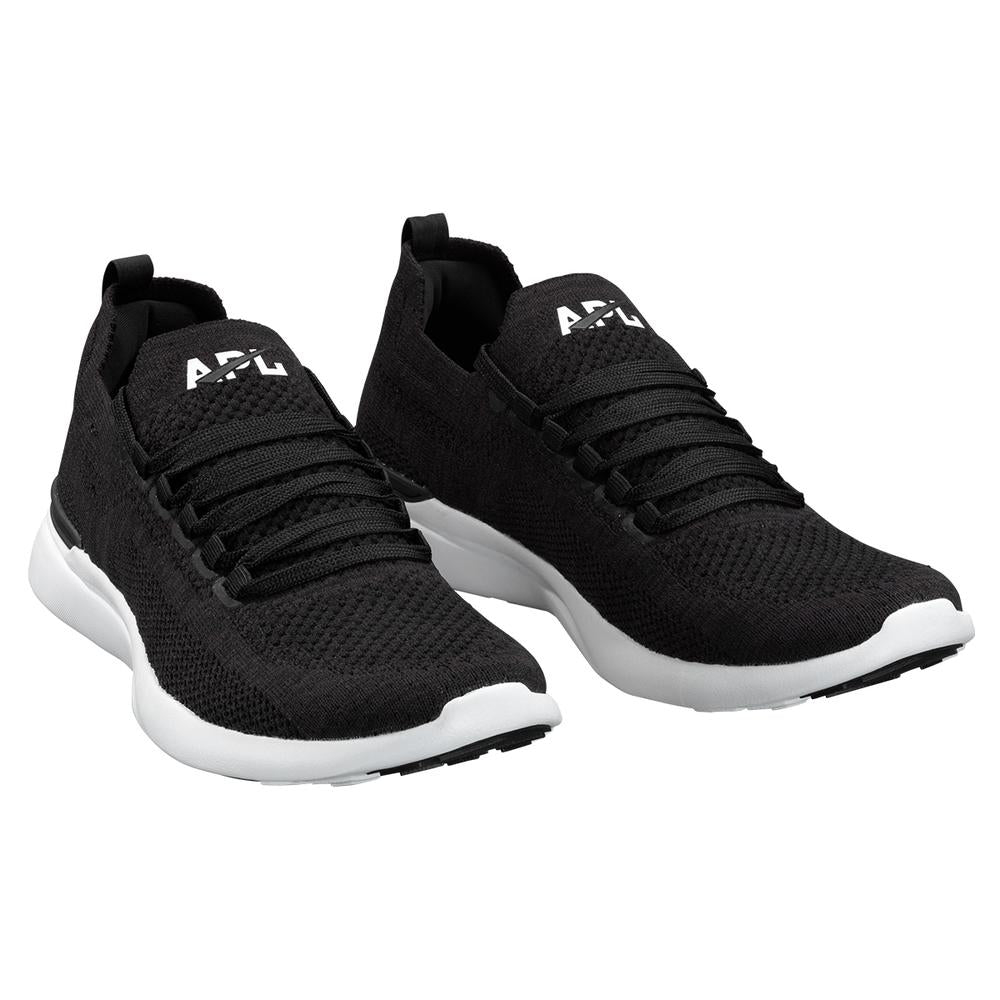 Front angled view of the Women's Techloom Breeze by APL in the color Black/White