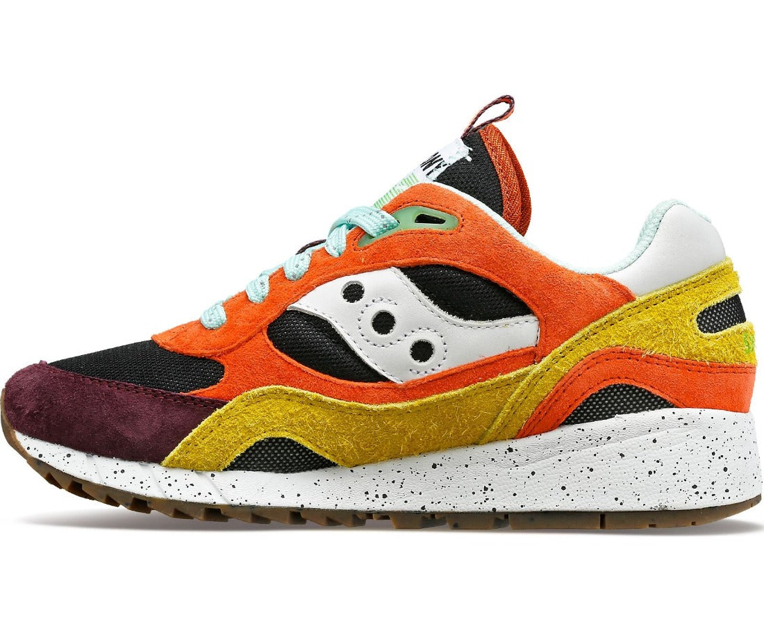Medial view of the Saucony Shadow 6000 Trailian (Unisex sizing) in the color Coral / Mustard