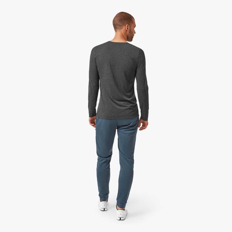 Back view of a model wearing the Men's Comfort Long Sleeve shirt by ON in the color Black