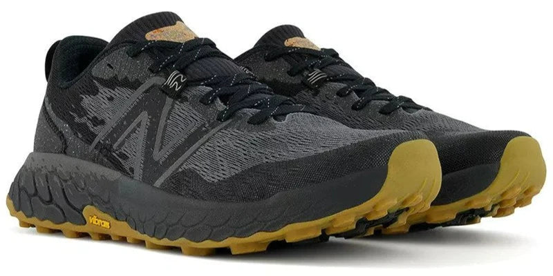 Front angled view of the Men's Hierro V7 trail runner by New Balance in the color Black/Black