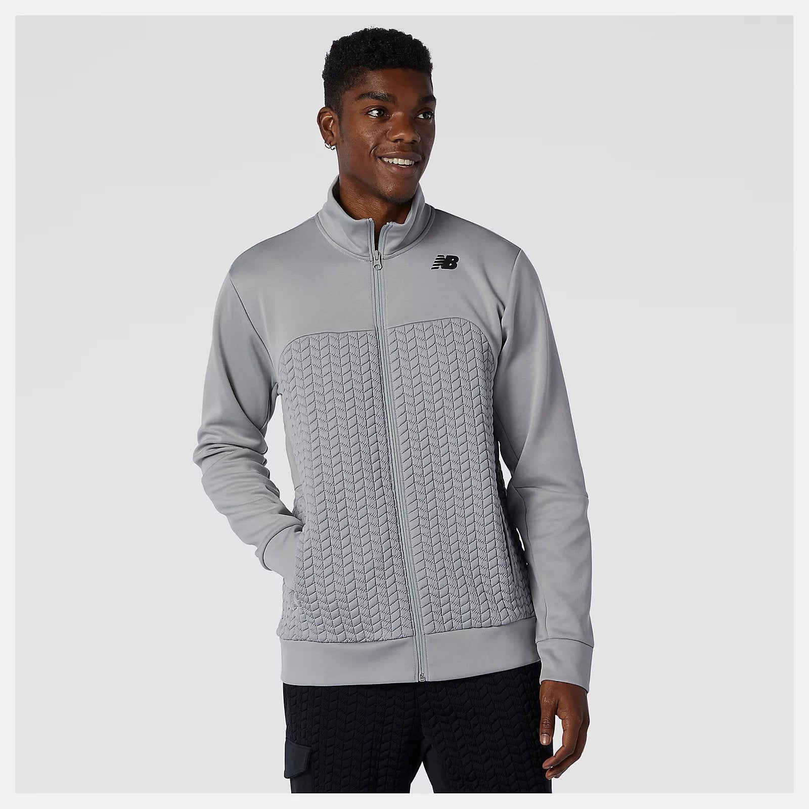 Front view of a model wearing the Men's Heat Loft Full Zip by New Balance in the color Alloy