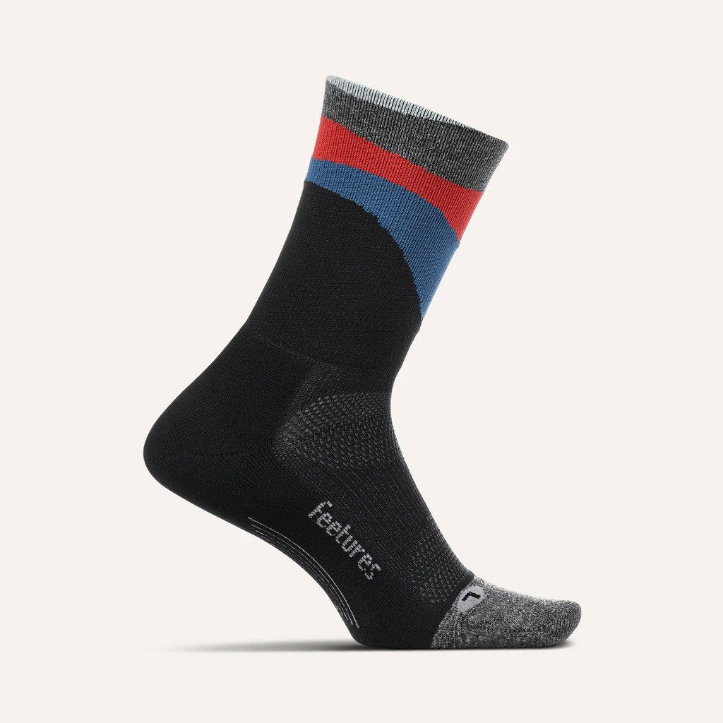 Medial view of the Feetures Elite Light cushion mini crew sock in the color Retrograde Black.