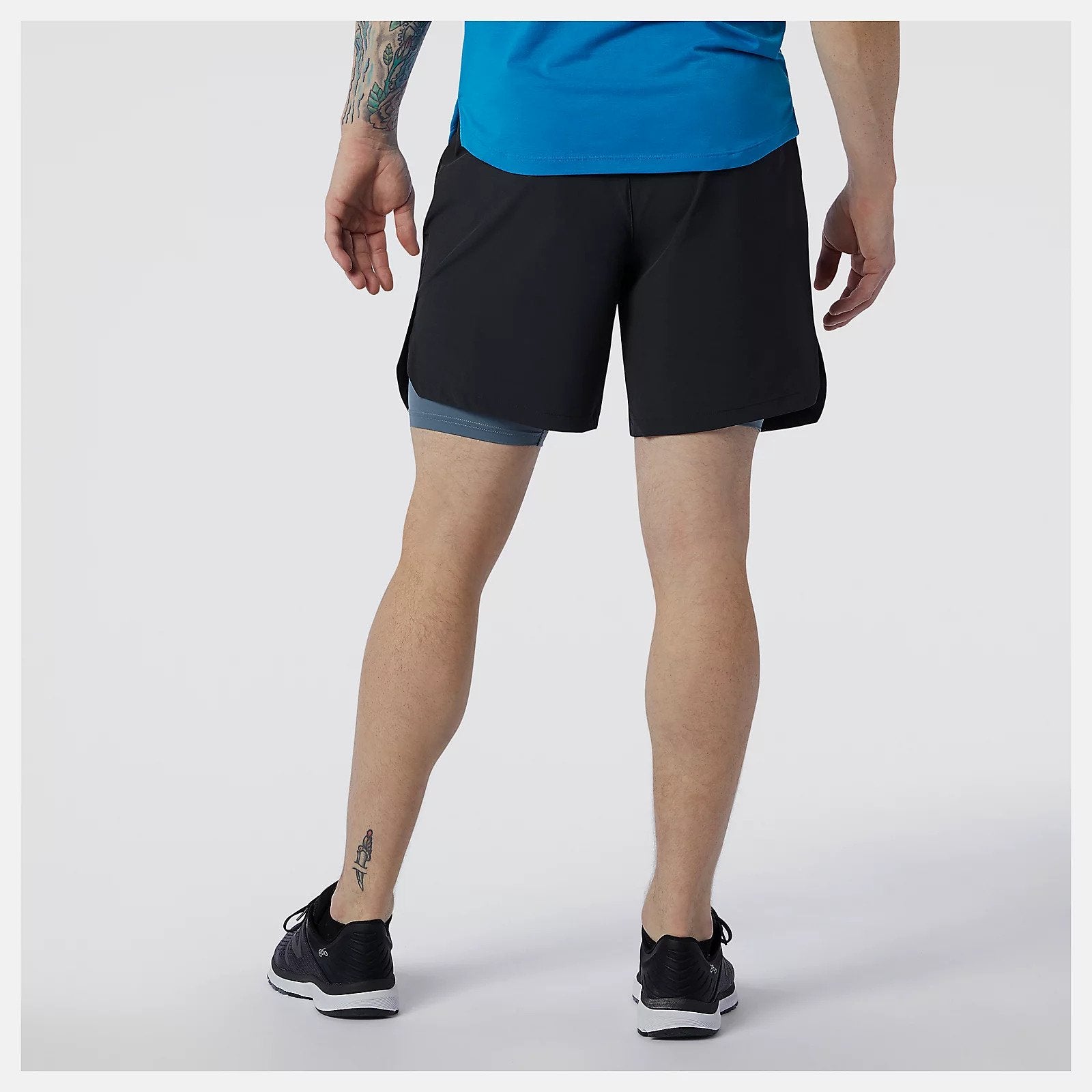 Rear view of the Fortitech 7" 2 in 1 Men's Short by New Balance in Black/Grey