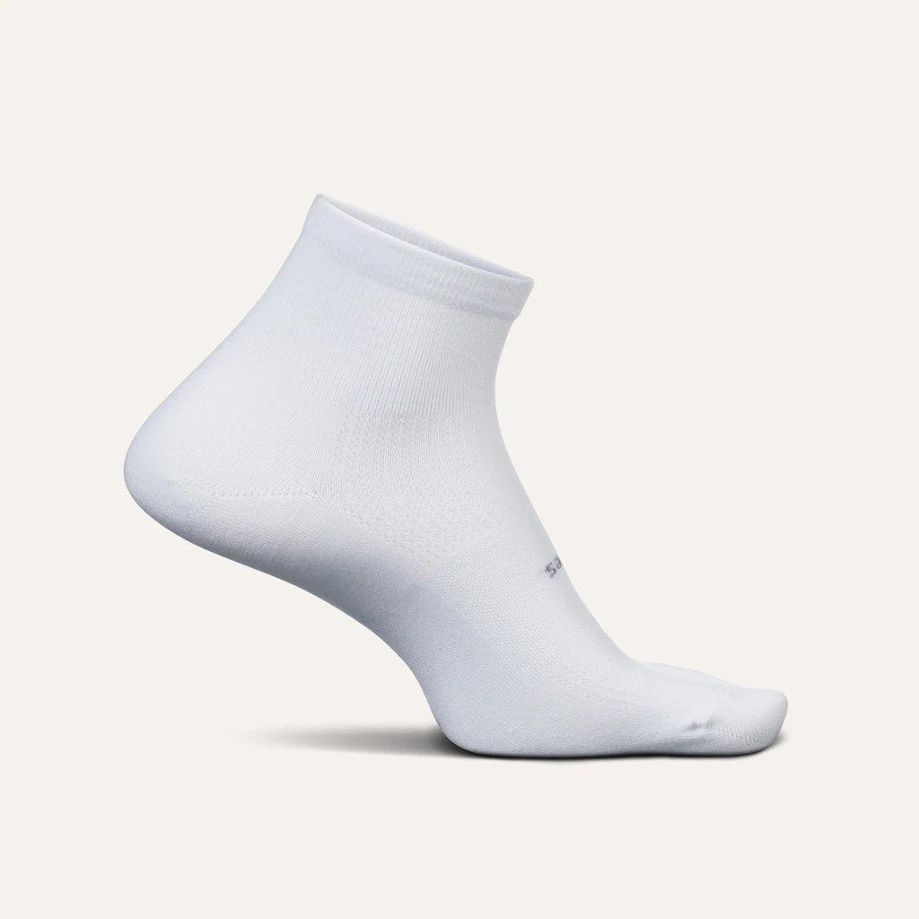 Medial view of the Feetures High Performance Ultra Light cushion sock Quarter height in the color white