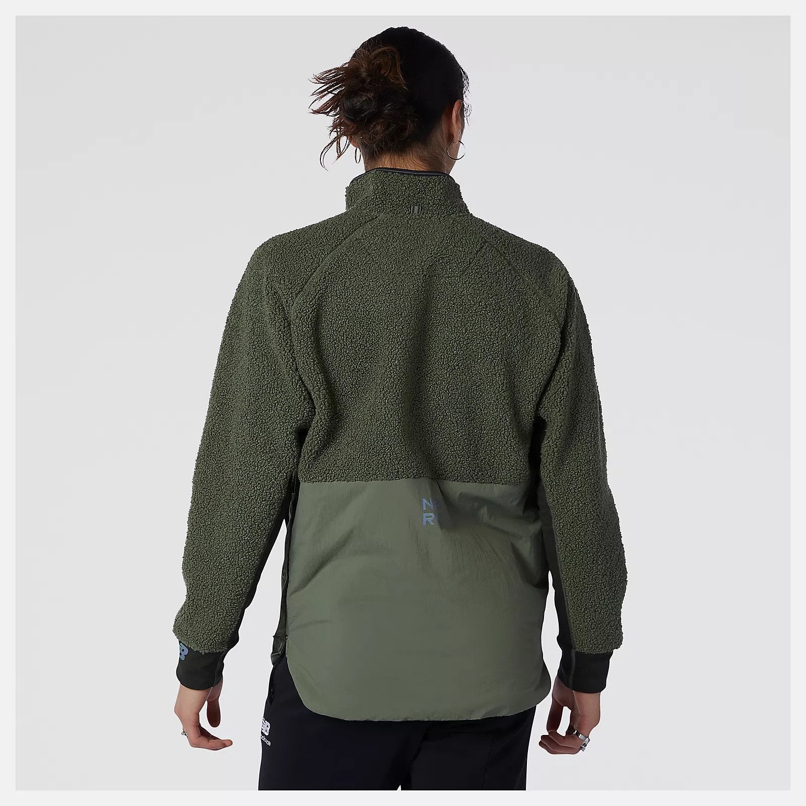 Back view of a model wearing the Men's Q-Speed Sherpa Anorak in the color Norway Spruce