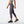 Side view of a model wearing the Women's Printed Accelerate Capri by New Balance in the color Black/Multi