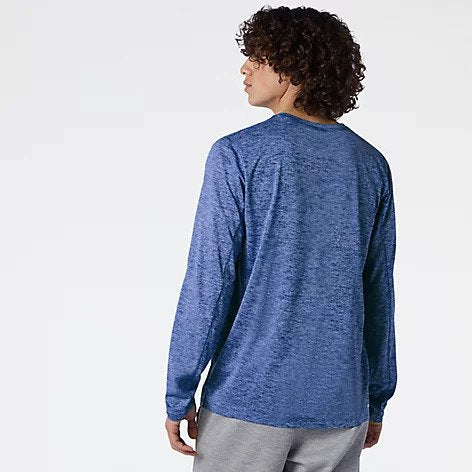 Back view of a model wearing the Men's Tenacity Long Sleeve by New Balance in the color Serene Blue Heather