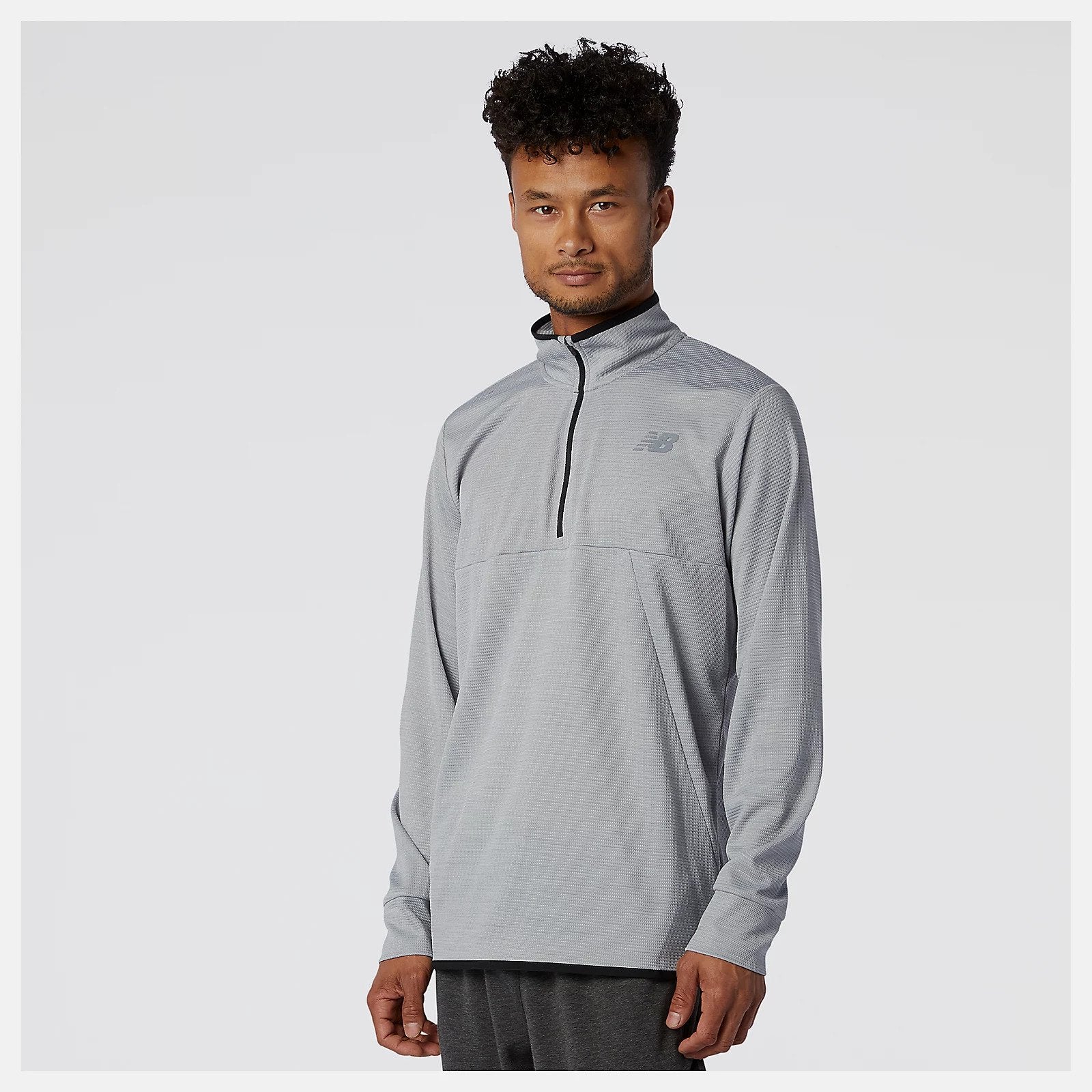 Front view of a model wearing the Men's Tenacity Quarter Zip by New Balance in the color Athletic Grey