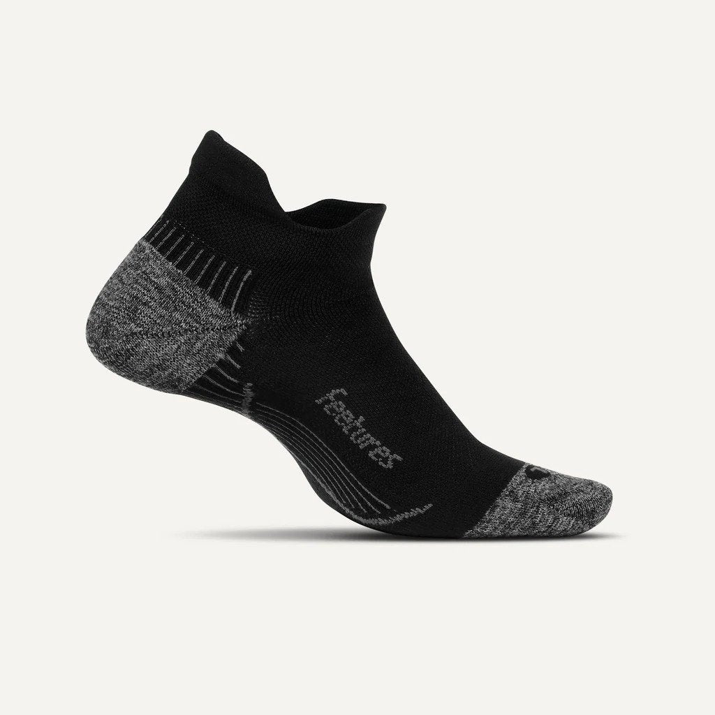 Medial view of the Feetures Plantar Fasciitis Relief sock in the light cushion no show tab style.  The color is black.