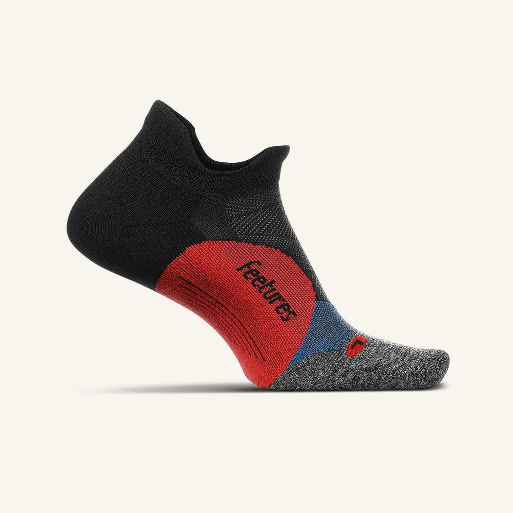 Medial view of the Feetures Elite Light Cushion no show tab sock in the color bounce black
